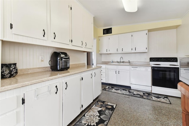 kitchen featuring white appliances and white cabinets