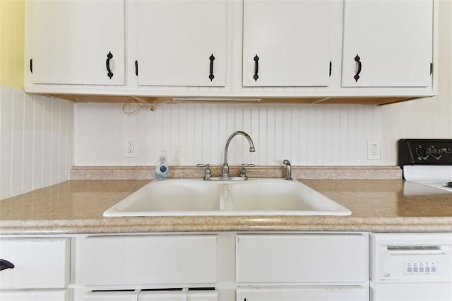 kitchen with white cabinets and sink