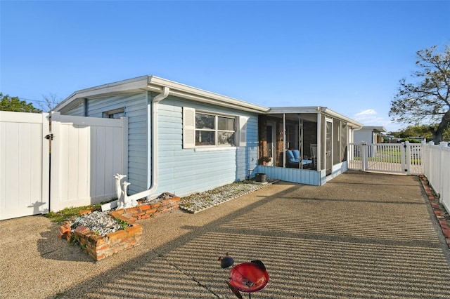 view of front of home with a sunroom