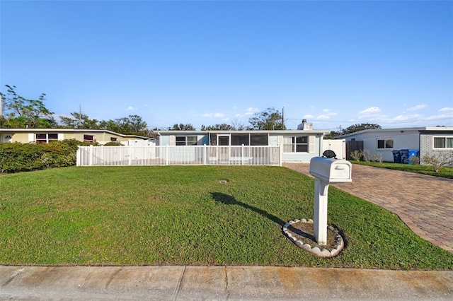 view of front of home with a front lawn