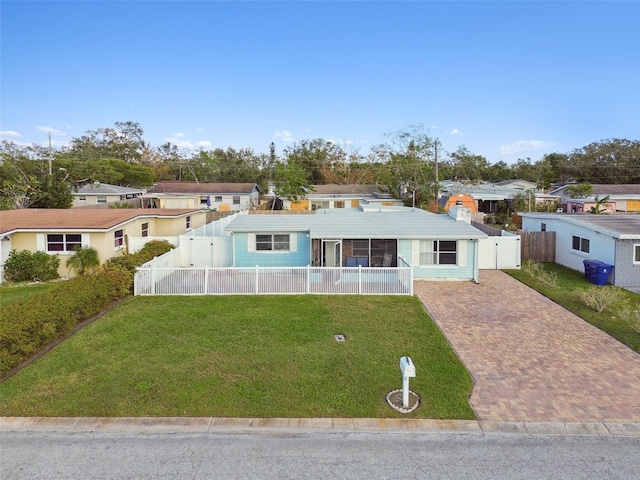 ranch-style home with a front lawn