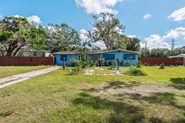 back of property with a lawn