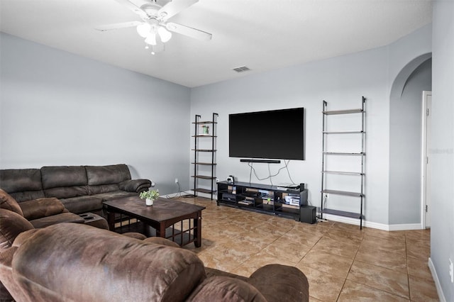 living room with tile patterned flooring and ceiling fan