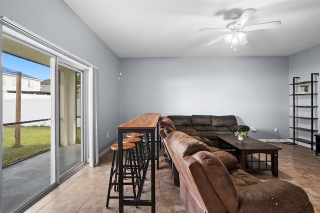 tiled living room featuring ceiling fan