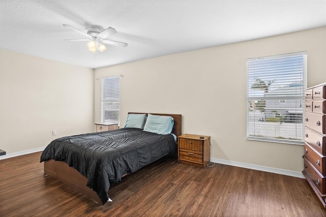 bedroom featuring ceiling fan and dark hardwood / wood-style floors