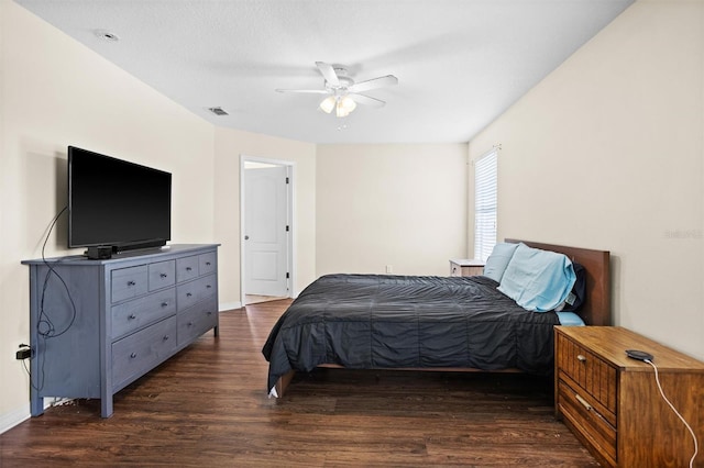 bedroom featuring dark wood-type flooring and ceiling fan