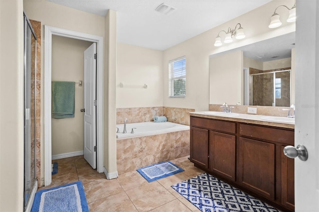 bathroom featuring vanity, tile patterned floors, and separate shower and tub