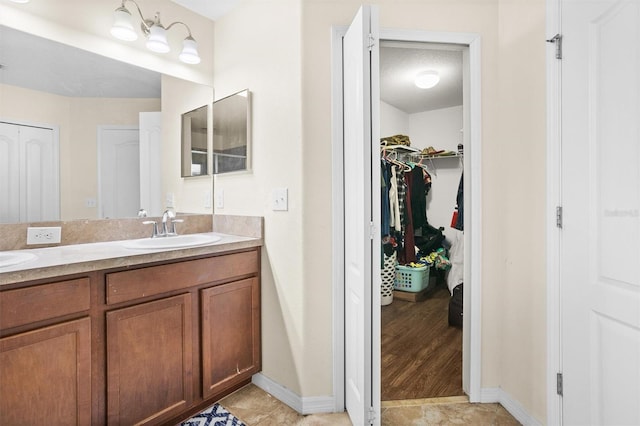 bathroom featuring vanity and wood-type flooring