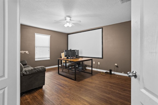 office with ceiling fan, a textured ceiling, and dark hardwood / wood-style flooring