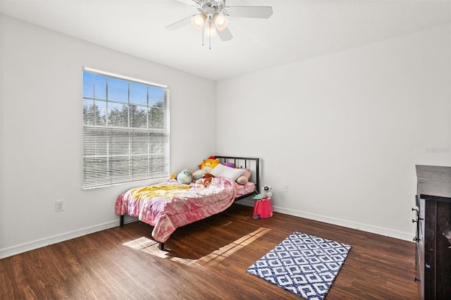 bedroom featuring dark wood-type flooring and ceiling fan