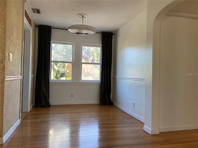 spare room with hardwood / wood-style floors