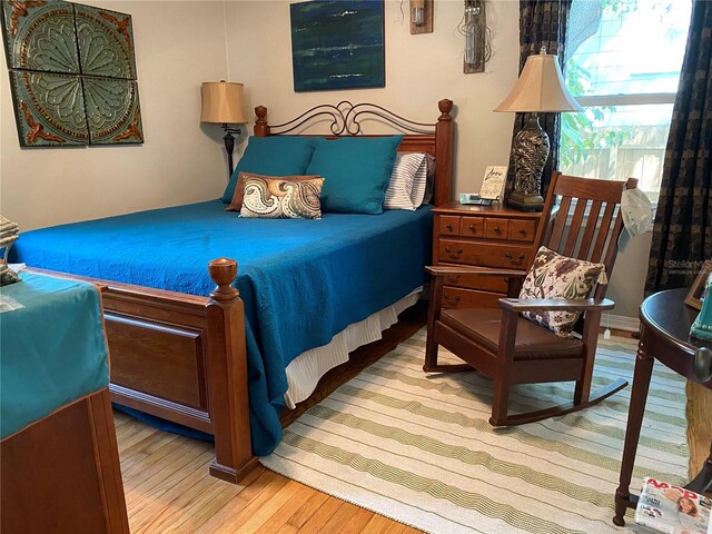 bedroom with light hardwood / wood-style floors