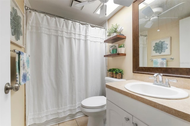 bathroom featuring vanity, ceiling fan, tile patterned flooring, toilet, and curtained shower