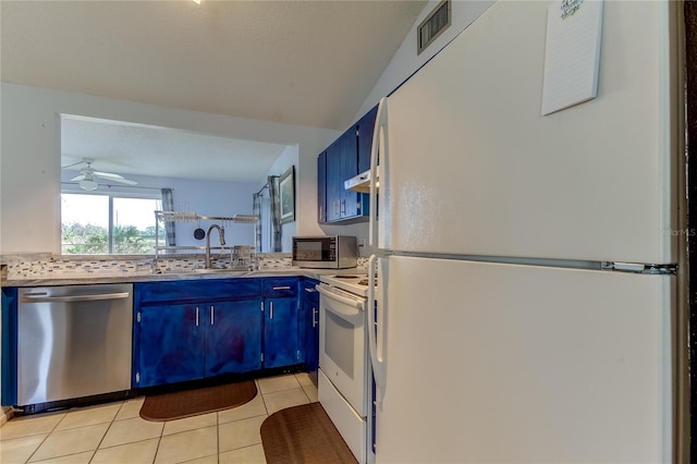 kitchen with stainless steel appliances, blue cabinets, ceiling fan, sink, and light tile patterned flooring