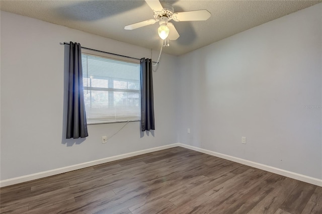 empty room featuring ceiling fan, a textured ceiling, and hardwood / wood-style flooring