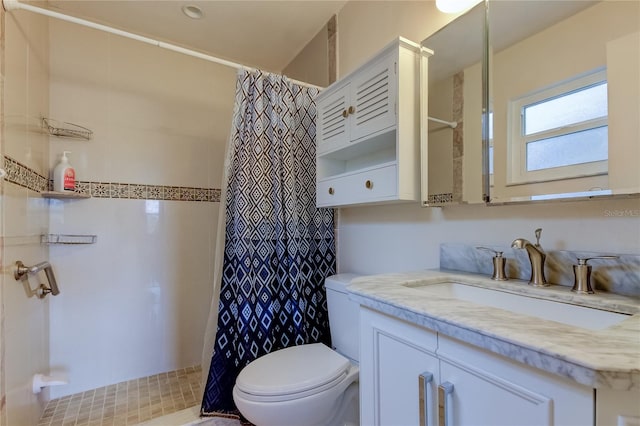 bathroom featuring vanity, a shower with shower curtain, and toilet