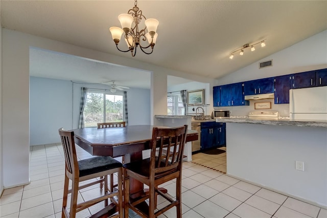 dining space with lofted ceiling, light tile patterned floors, visible vents, and ceiling fan with notable chandelier