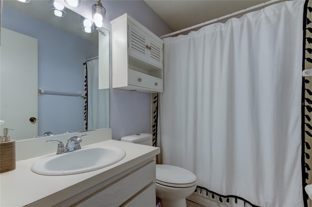 full bath with toilet and vanity