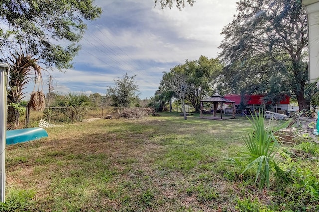 view of yard featuring a gazebo and fence