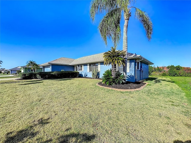 single story home with a front yard