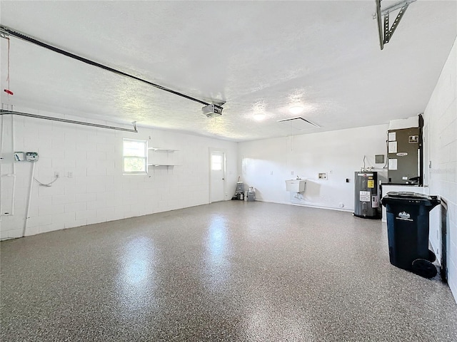 garage featuring electric water heater, heating unit, and a garage door opener