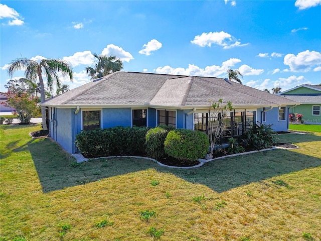 ranch-style house featuring a front lawn