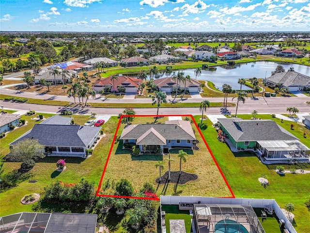 birds eye view of property featuring a water view