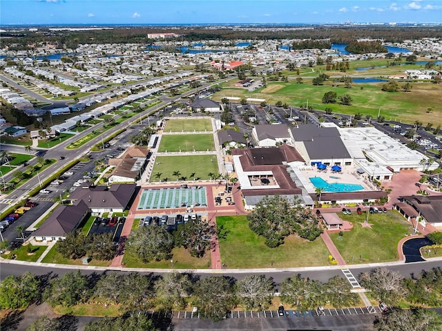 view of property location with a large body of water and a pool