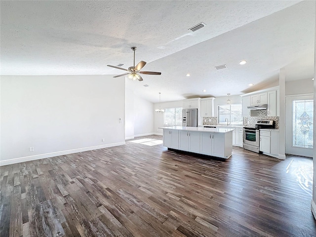 unfurnished living room with dark wood-style flooring, baseboards, a ceiling fan, lofted ceiling, and a sink