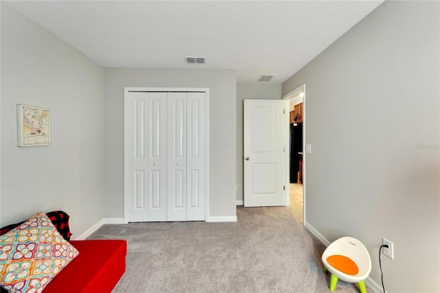 sitting room with light colored carpet