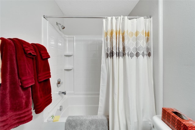 bathroom with a textured ceiling and shower / tub combo with curtain