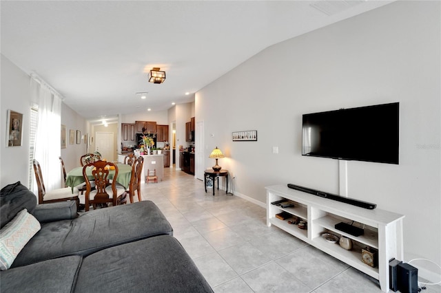 tiled living room with lofted ceiling