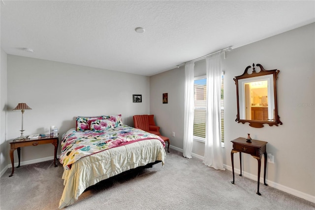 carpeted bedroom with a textured ceiling