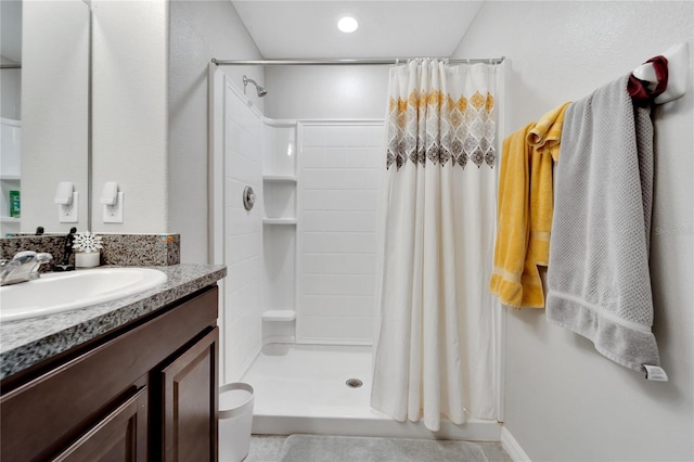 bathroom featuring vanity and walk in shower