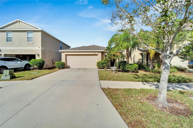 view of front of house with a front lawn and a garage