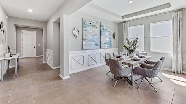 dining area with light tile patterned flooring