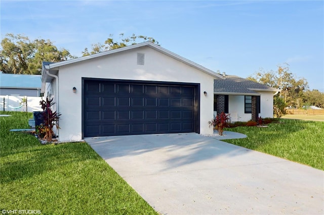 ranch-style home with a garage and a front lawn