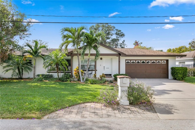 ranch-style home with a garage and a front yard