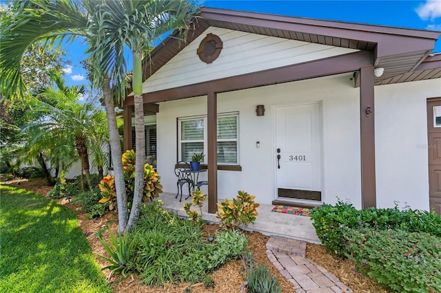 3401 W N B St, Tampa, FL 33609 - property entrance with a porch and stucco siding