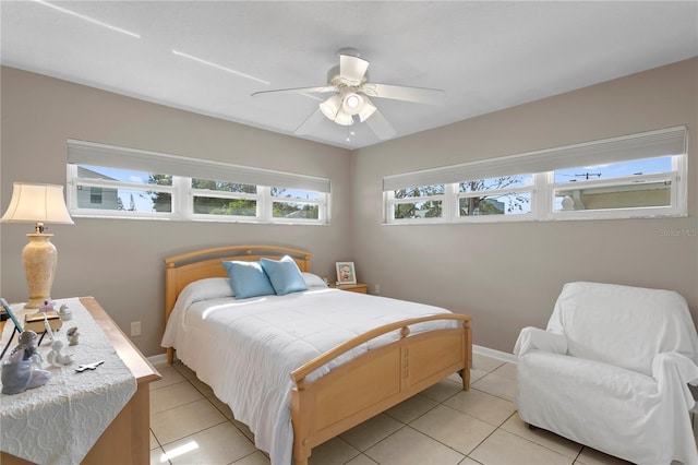 tiled bedroom with ceiling fan