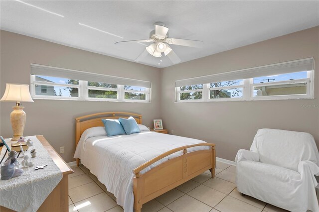 3401 W N B St, Tampa, FL 33609 - bedroom featuring light tile patterned flooring, ceiling fan, and baseboards
