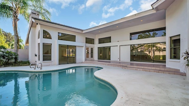 view of swimming pool featuring a patio