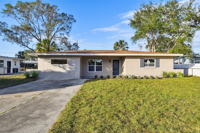 ranch-style home with a front lawn