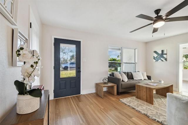 interior space featuring light wood-type flooring and ceiling fan