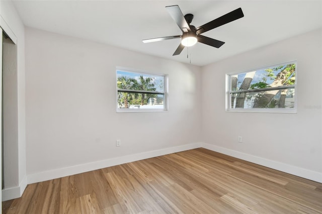 unfurnished bedroom with light hardwood / wood-style flooring, multiple windows, and ceiling fan