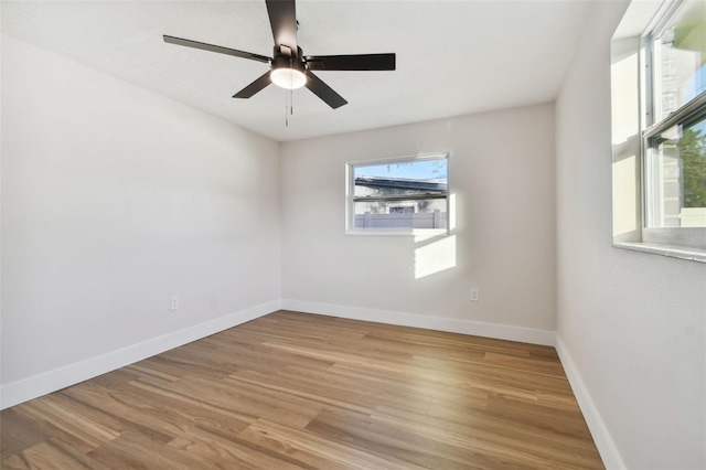 spare room featuring light hardwood / wood-style flooring and ceiling fan