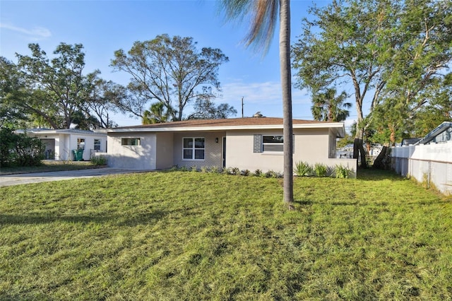 ranch-style house with a front lawn