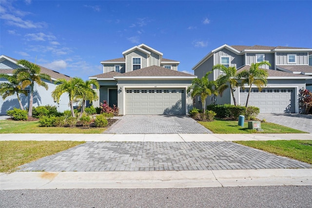 view of front of house with a front lawn and a garage