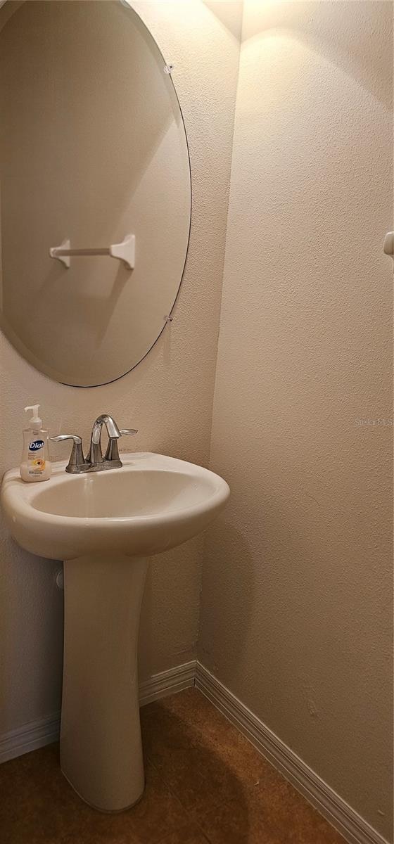 bathroom with tile patterned floors and sink