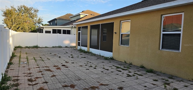 view of patio / terrace with a sunroom